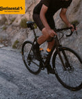 Person riding gravel bike with Cross 28 Inch Bicycle Inner Tube Bundle 700x32 47c with 42mm Presta Valve Four Pack Plus Sticker