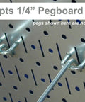 Close-up of Heavy Duty White Steel Pegboard Panels Set Two 32 By 16 Inch for Garage with metal hooks inserted