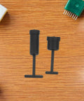 Top Notch 24 Pc G9 Light Socket Ring Replacement Kit with Plastic Shade Holder Adapter And Removal Tool For Super Quick Install Preventing Detached Shades From Falling Off. Two black plastic G9 lamp socket adapters with removal tool on wood