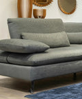 Adjustable Furniture Legs With Wheels 4 Pack No Sweat Install Heavy Duty Cold Rolled Steel visible on a gray sofa in a room.