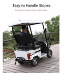 Top Shelf Electric Golf Cart For Two With Kickass 800W Motor, Smooth Riding Mobility Scooter with a driver on a slope.
