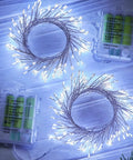 Firecracker String Lights 60 LED Battery Operated 5 Feet 2 Pack With Remote, pure white twinkle lights displayed on a surface