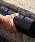 Hand installing Semi Circular Rubber Dock Guard For Outer Wheel And Port Docks Extruded Rub Rail That Protects Boats