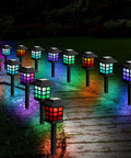 24 Pack Solar Pathway Lights Outdoor Waterproof LED Solar Powered Landscape Lighting illuminating a garden path.