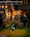 Child playing outside a house at night with 16 Inch 2 Pack Large Motion Sensor Outdoor Wall Lights Dusk To Dawn Porch Lights illuminating the area.