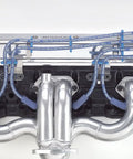 Vehicle Specific Wire Loom Kit With Chrome Engine Brackets shown on engine, highlighting organized wiring and chrome fittings.