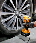 Mechanic using Cordless Brushless Half Inch Chuck Impact Wrench With 700 Nm Breakaway Torque And 515 Ft Lbs Max 3600 IPM And 2800 RPM Your Go To Heavy Duty Tire Lug Nut Gun For DIY Auto Repair And Car Tire Removal to remove lug nuts from car wheel.