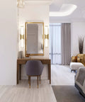 Modern bedroom with vanity featuring Caper 24 Inch LED Vanity Light In Brushed Brass With Frosted Lens Dimmable Hardwired Fixture