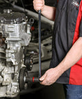 Mechanic using Three Eighths Inch Drive Ratcheting Breaker Bar, 15 Inch Length, 24 Tooth Ratchet, on car engine bolt