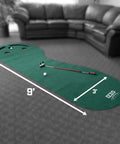 Three Hole Indoor Putting Mat For Home Golf Practice, 3 Foot By 9 Foot With Kidney Shaped Layout, Triple Cup Putt Training Aid And Sand Trap Cutouts placed in living room