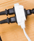 Close-up of Three Outlet Indoor Extension Cord with Twelve Foot Power Strip 16 Gauge UL Listed Twist To Close Safety Covers