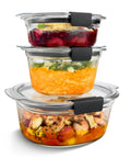 Top Shelf Round Glass Food Storage Containers With Tight Lock Lids, stacked with colorful meals inside, leak proof and oven safe.