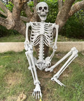 5.4Ft Life Size Halloween Skeleton With Movable Joints For Indoor Outdoor Setup Weather Resistant Full Body Prop Great For Spooky Halloween Displays Haunt Decor Durable And Foldable For Easy Storage sitting under a tree