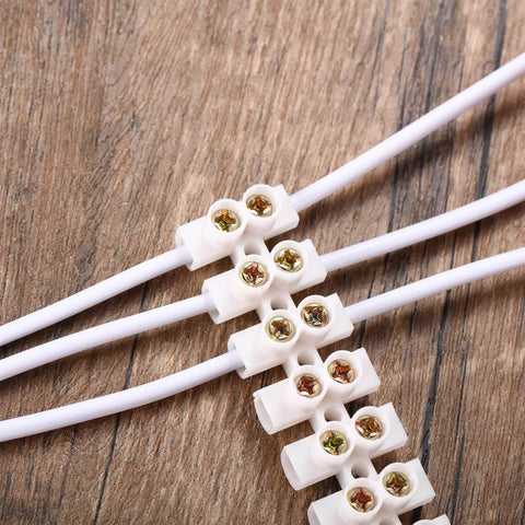 Close-up of 12-Position Dual Row White Screw Terminal Block Set 10 A 380 V Wire Connector Electrical Barrier Block