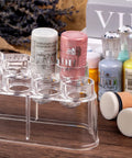 Slick Ace Clear Storage Rack And Organizer For Craft Paint Bottles And Blending Tools holding jars on wooden surface.