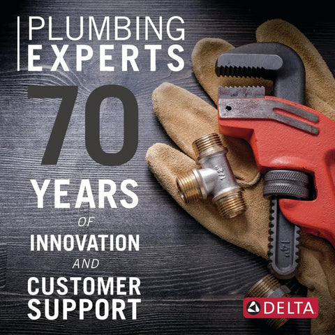 Plumbing experts celebrating 70 years, featuring a red pipe wrench and brass fittings on a wooden surface.