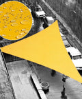 Orange Triangle 16 Ft By 16 Ft By 16 Ft Waterproof Sun Shade Sail installed over a patio in the rain, droplet detail inset.