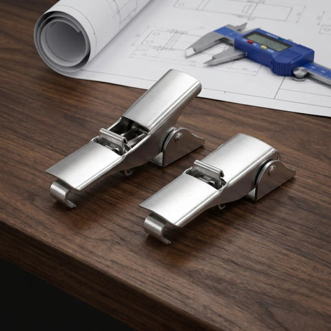 Heavy Duty Adjustable Stainless Steel Toggle Latch Hardware For Machinery Cabinet Doors With Vibration Resistant Anti Slip Polished Locking System Perfect For Toolbox And Industrial Draw Fastener Needs Now on wooden surface with measuring tools.