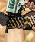 Close-up of Two And A Half Inch Coil Siding Nailer Pro Bundle with exposed nail coil ready for installation.