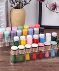 Slick Ace Clear Storage Rack And Organizer For Craft Paint Bottles And Blending Tools holding fifteen jars on a wooden desk.