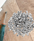 Get Your Hands On These 30pc Stainless Steel Flat Head Knurled Rivet Nuts That Are Totally Rad For Industrial And Metal Projects With Cool Corrosion Resistance, displayed with screwdriver.