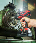 Beefy 20V Cordless Impact Wrench Kit With 300 Ft Lb Torque used on machinery in workshop setting