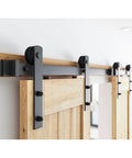 6.6FT Double Sliding Barn Door Hardware Kit for Two 20 Inch Door Panels with carbon steel track and nylon rollers, installed view