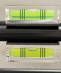 Magnetic Square Bubble Level Set Of 5 Pieces With 29mm 40mm And 52mm Levels For Quick Layouts And Precise Measurements In Carpentry And DIY Projects Strong Magnets Lightweight Aluminum Build Makes It Easy To Hang And Use All Day showing a close-up of a 29mm level on metal surface.