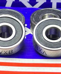 High Precision 8-Pack Skateboard Si3N4 Ceramic ABEC-7 Ball bearings angled view showcasing stainless steel construction.